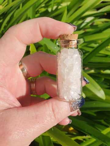 Glass bottle filled with Rose Quartz Crystal Chips